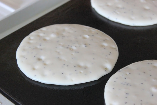 pancakes cooking on griddle