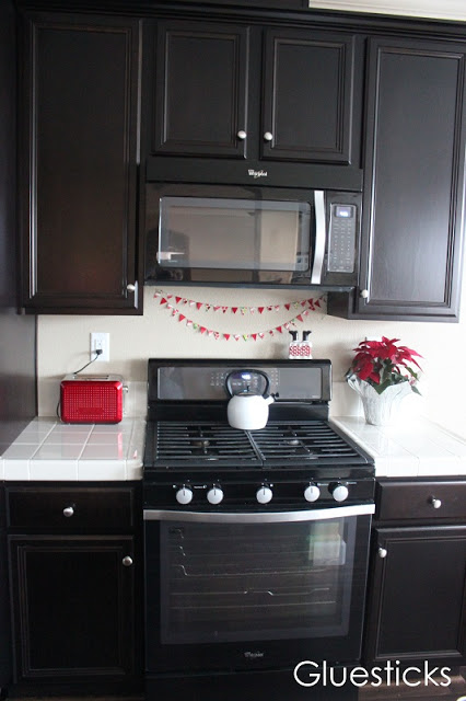 duct tape bunting draped on kitchen wall