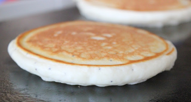 almond poppy seed pancake on griddle