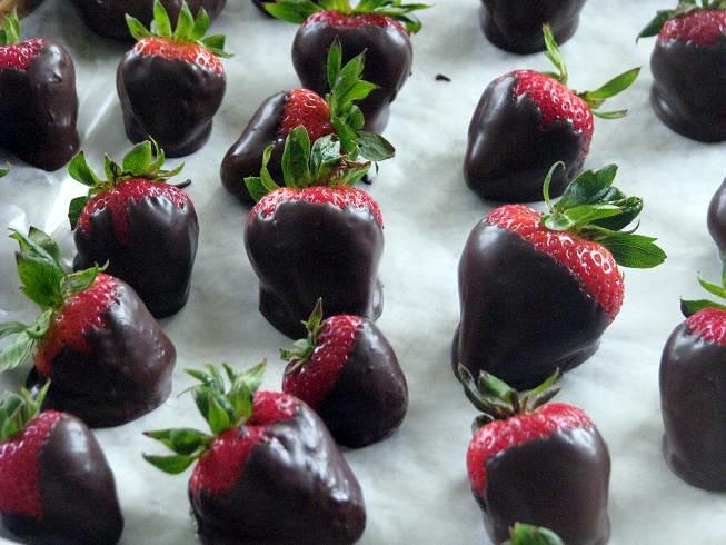 chocolate strawberries on baking sheet with parchment paper