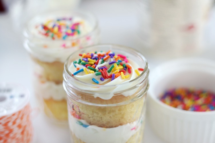 jar of cupcakes layered with frosting and sprinkles
