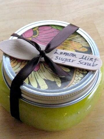jar of sugar scrub with wooden spoon