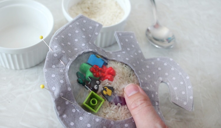 i-spy bag filled with rice and toys and pinned closed