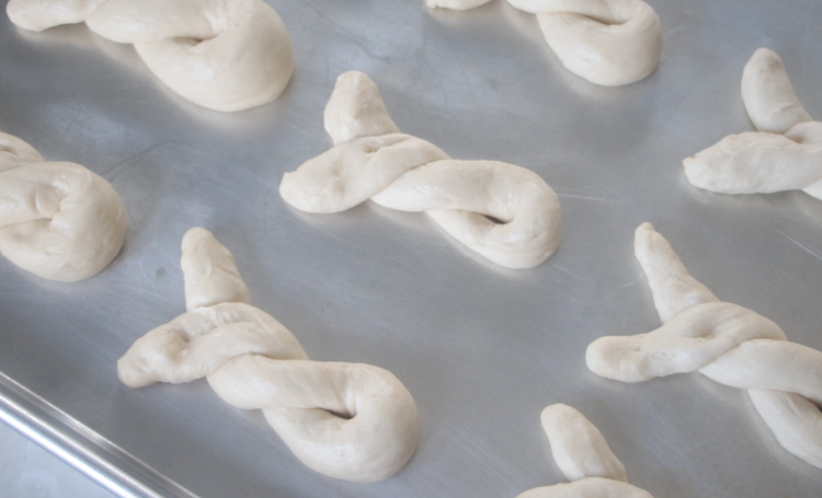 unbaked bunny rolls on baking sheet
