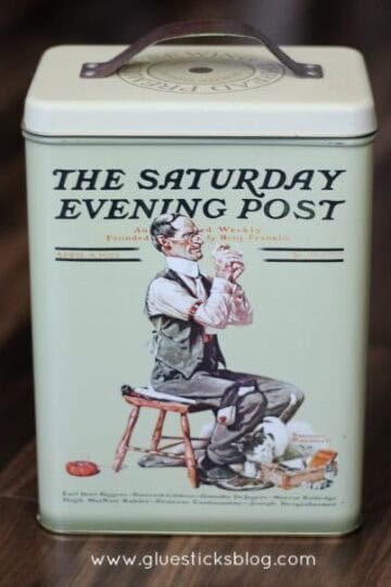 Saturday evening post themed tin