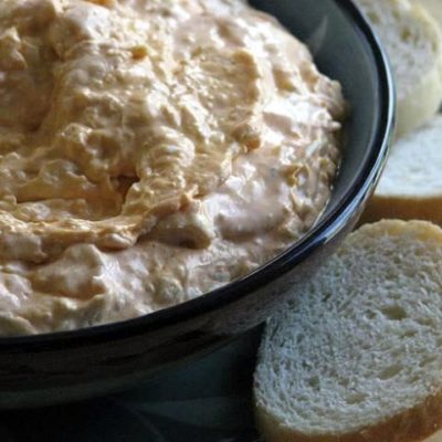 buffalo chicken dip in bowl with bread to the side