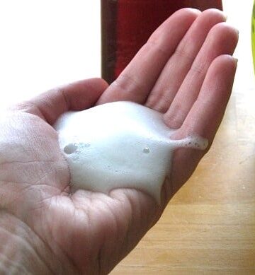 hand with foaming hand soap on it