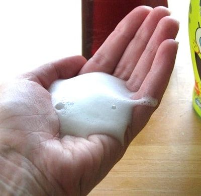 hand with foaming hand soap on it
