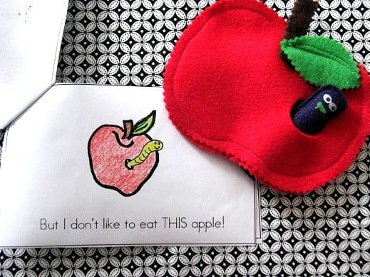 paper apple book for kids next to felt apple