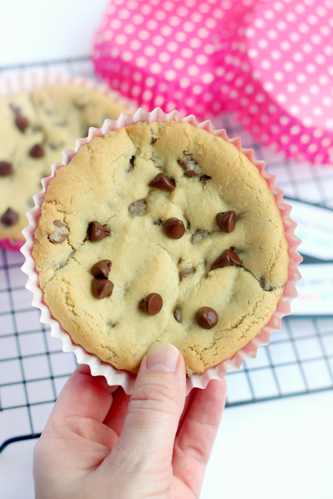 hand holding deep dish chocolate chip cookie