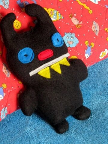 black rice bag shaped like a monster