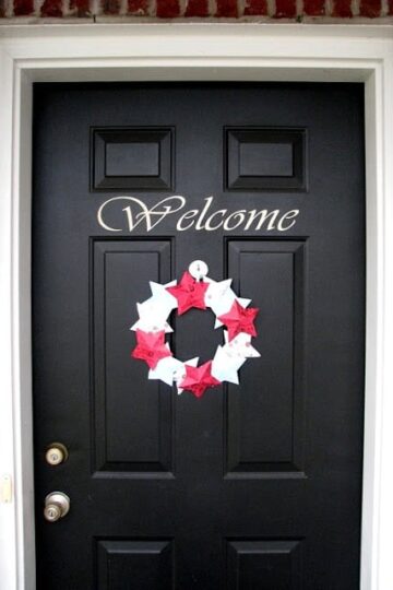 winter paper wreath on black door