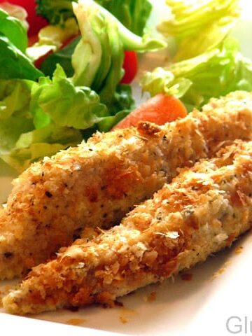 potato flake chicken strips with salad on plate
