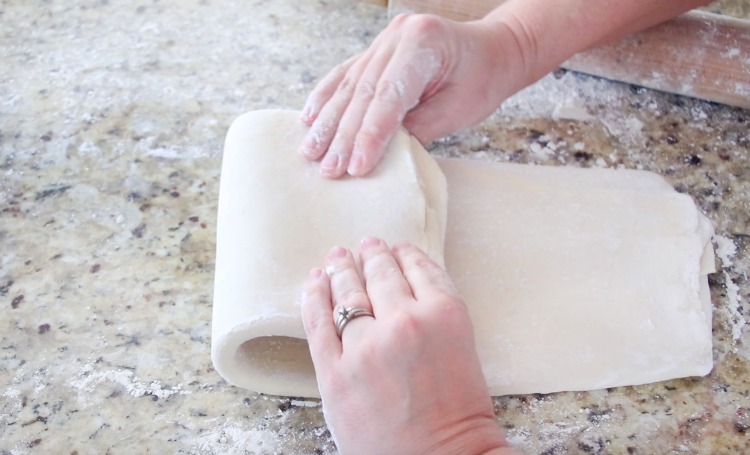 rolling puff pastry dough into thirds