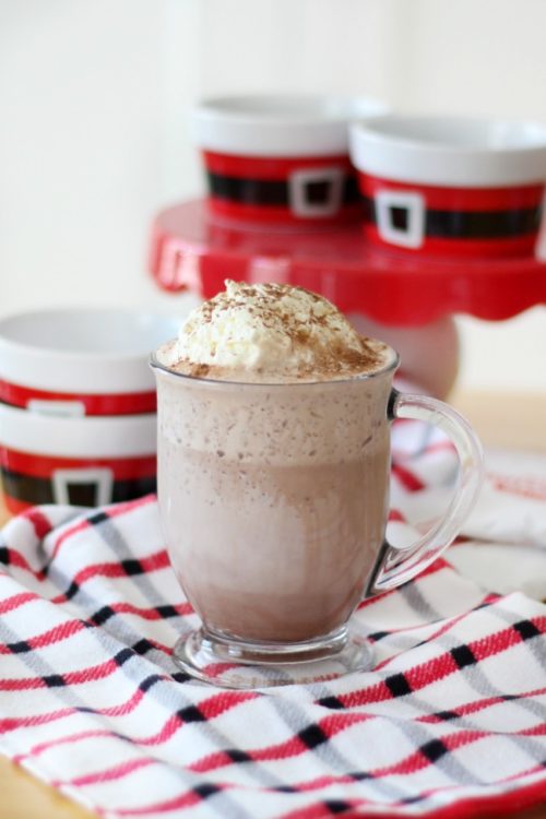clear mug of frozen hot cocoa on red, black and white hand towel
