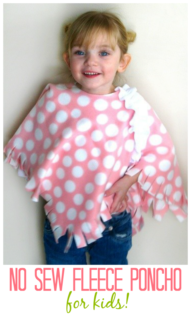 little girl wearing pink polka dot fleece poncho