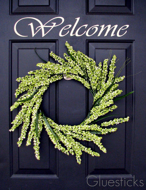 greenery wreath hanging on door