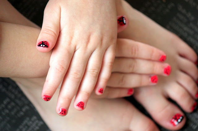 nails painted with red and black paint
