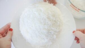 chicken cake covered in coconut