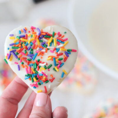hand holding dipped sugar cookie
