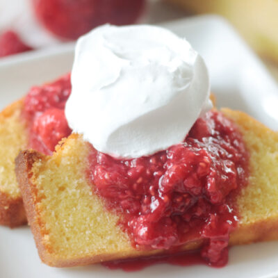 two slices of pound cake with raspberry sauce