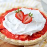 strawberry pie with whipped cream on top.