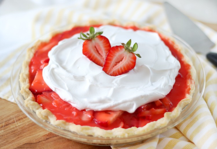 strawberry pie with whipped cream on top.