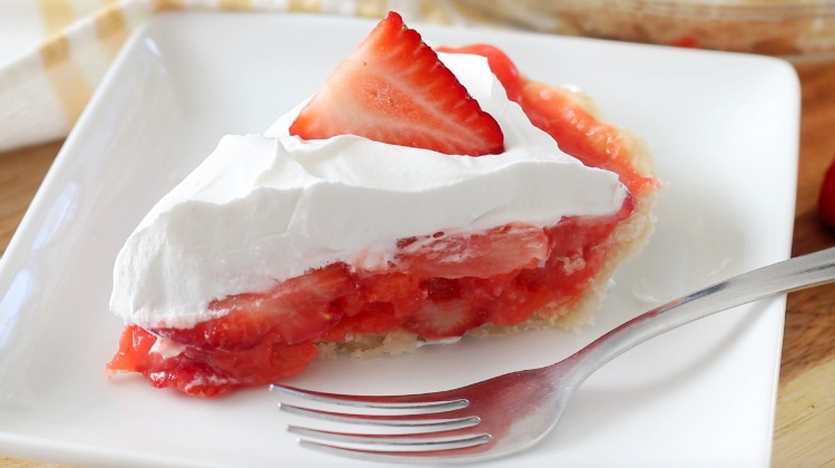 slice of pie on a white plate with fork