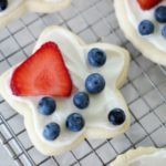 star shaped cookie with frosting and fruit