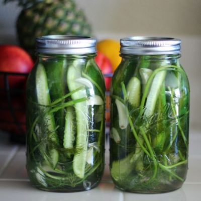 two jars of pickles on counter