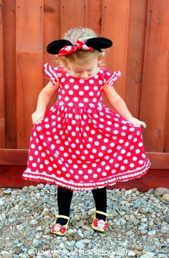 little girl wearing Minnie Mouse dress