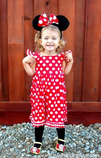 little girl wearing Minnie Mouse dress