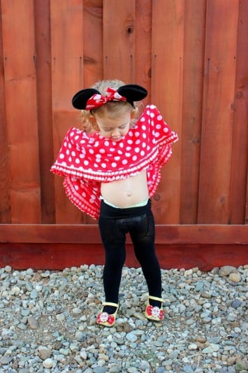 little girl wearing Minnie Mouse dress