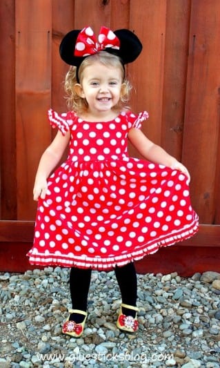 little girl wearing Minnie Mouse dress