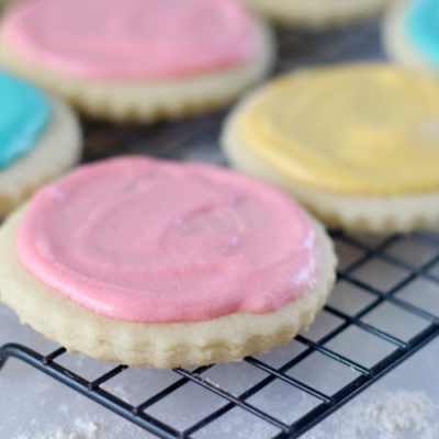 sugar cookies frosted on cooling rack