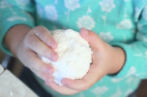 child holding snowball soap