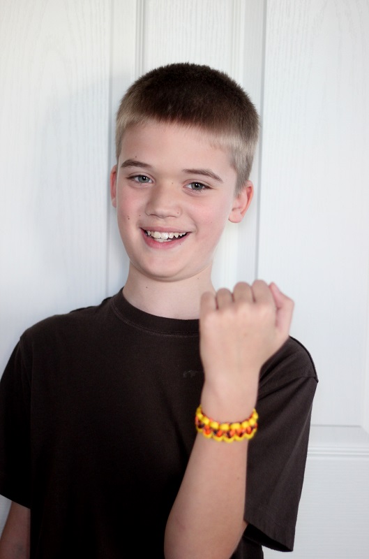 boy with paracord bracelet