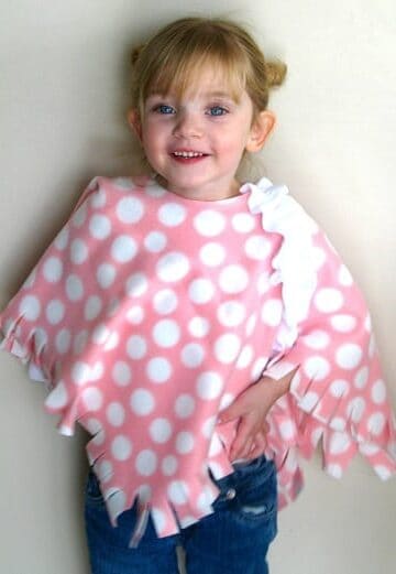little girl wearing fleece poncho