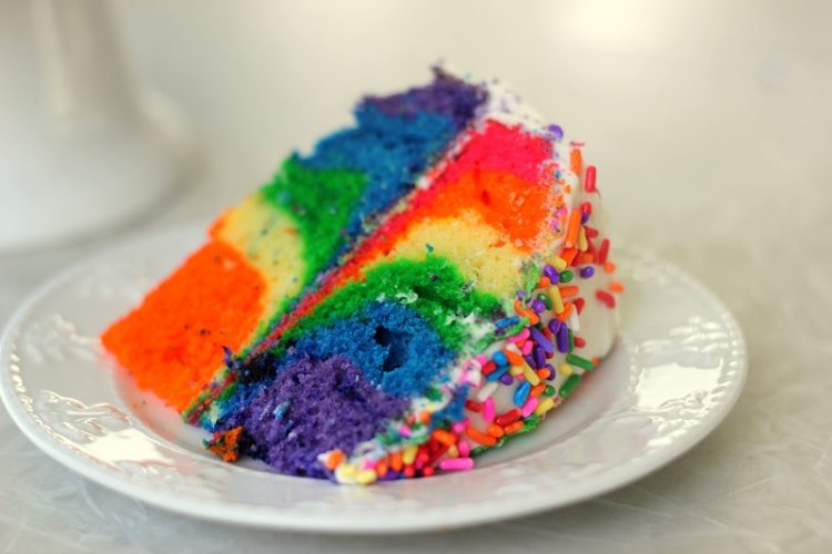 slice of tie dyed cake on white plate