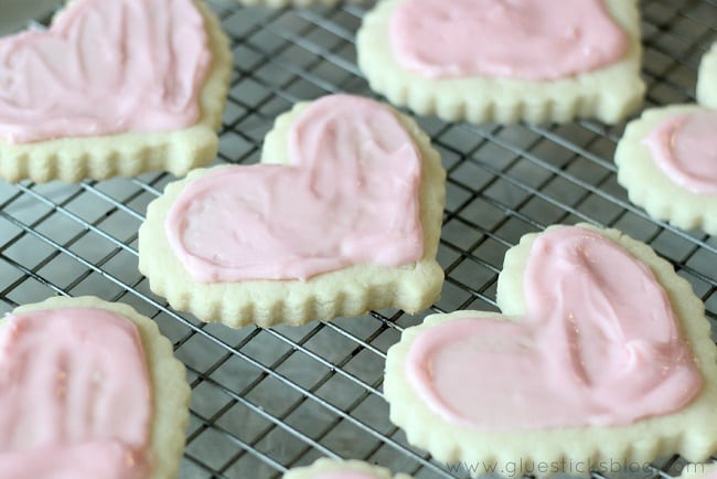 valentine sugar cookies on baking rack