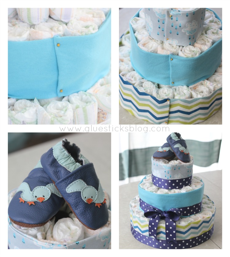 An April Showers diaper cake for a springtime baby shower. Complete with diapers, shoes, and receiving blankets.