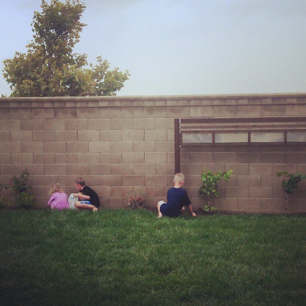 kids weeding flower beds