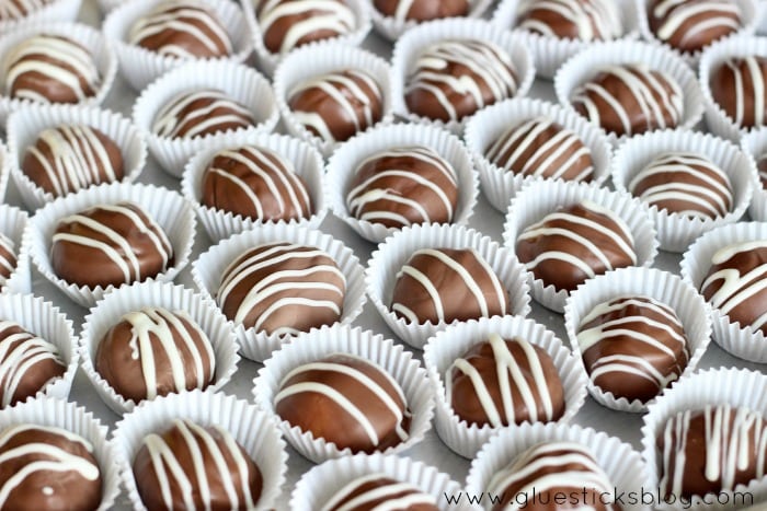 Premium Photo  Top view of squeezing filling of salted caramel cream from  confectionery bag into candy molds for preparing handmade chocolate pralines