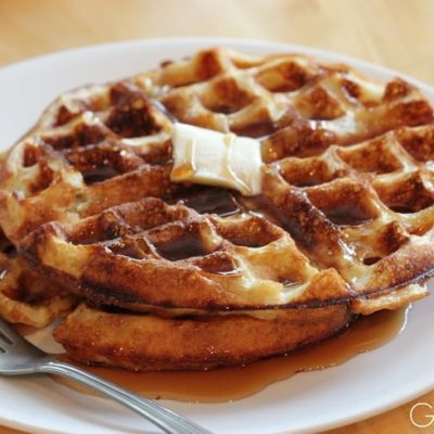 waffles with butter and syrup on white plate
