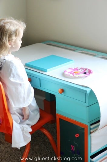 little girl at art desk