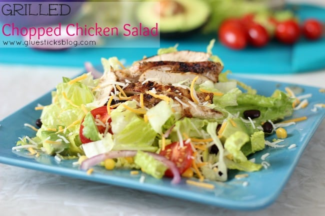 grilled chicken salad on a blue plate