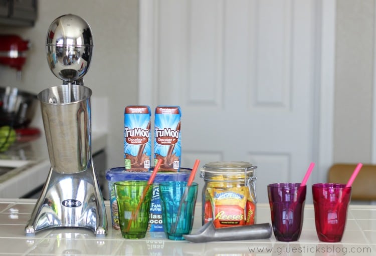 glass cups next to milkshake machine