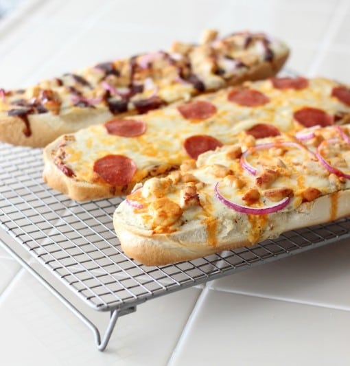 French bread pizzas on cooling rack