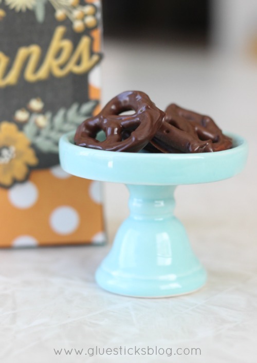 chocolate covered pretzels on small dessert stand