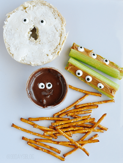 eyeball bagel, nutella with candy eyes and celery and peanut butter with eyeball candies